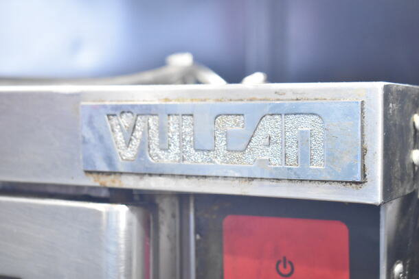 Vulcan Wells Commercial Convection Oven, Model VC4GD-11D350K, with metal legs and logo plate.