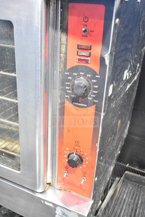 Vulcan Wells VC4GD-11D350K convection oven with view-through doors, thermostatic controls, on metal legs, commercial casters.