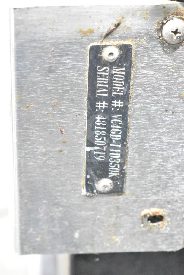 Serial number plate for Vulcan Wells Convection Oven, model VC4GD-11D350K, shows model and serial number details.