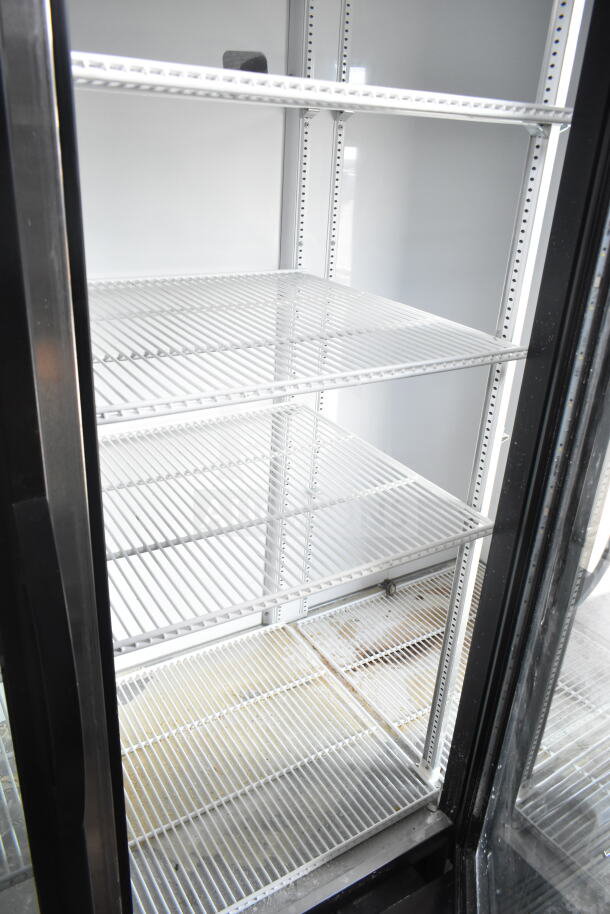 2019 True GDM-72-HC commercial cooler with 3 glass doors, white wire shelves, and room for ample product display. 115V, 1 phase.