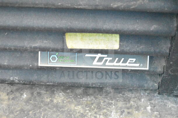 2017 True GDM-49-HC commercial cooler logo. Features "natural refrigerant" label. Auction item, inspect condition.