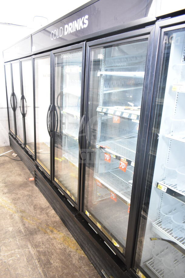2017 True GDM-72-HC commercial 3-door cooler merchandiser, glass doors, "Cold Drinks" label, 115 volts, 1 phase.