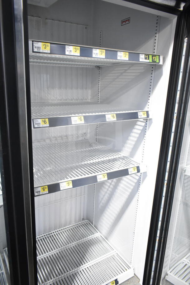 2017 True GDM-72F-HC Commercial 3 Door Freezer, shelves with price tags, excellent condition, 115/208-230V, 1 Phase.