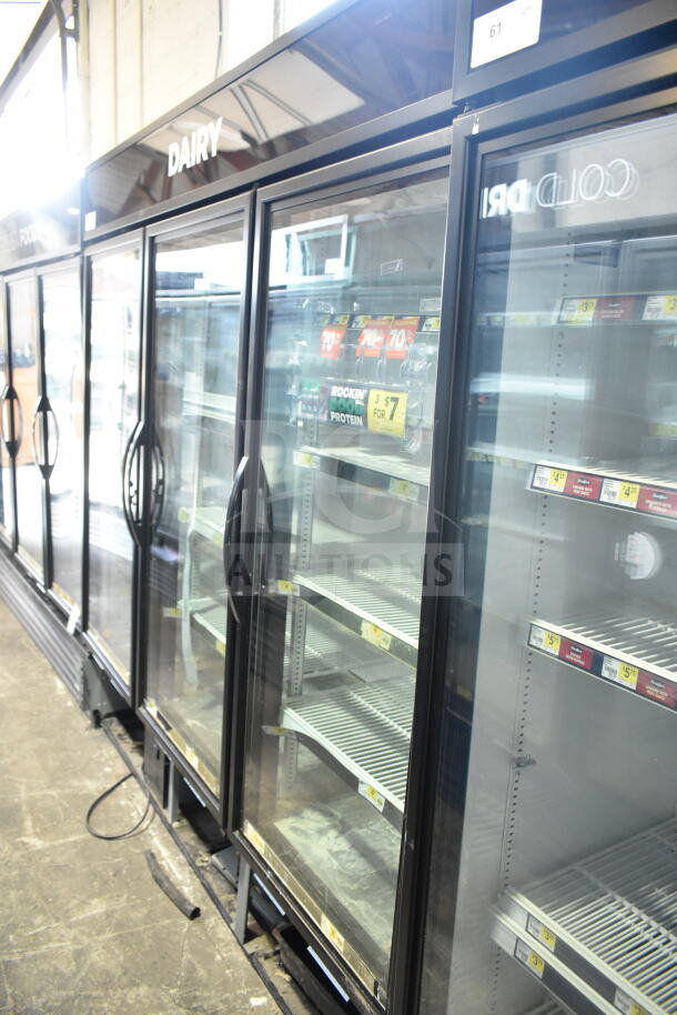 2017 True GDM-72-HC commercial 3-door reach-in cooler merchandiser, 115V, 1 phase, visible shelving, labeled "Dairy."