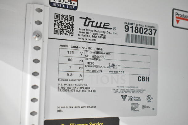 True GDM-72-HC label detailing model info, voltage, phase, amperage, refrigerant type, and design pressures.