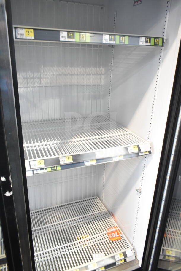 2017 True GDM-72F-HC commercial freezer, 3-door, reach-in, adjustable shelves, good condition, model labeling visible.