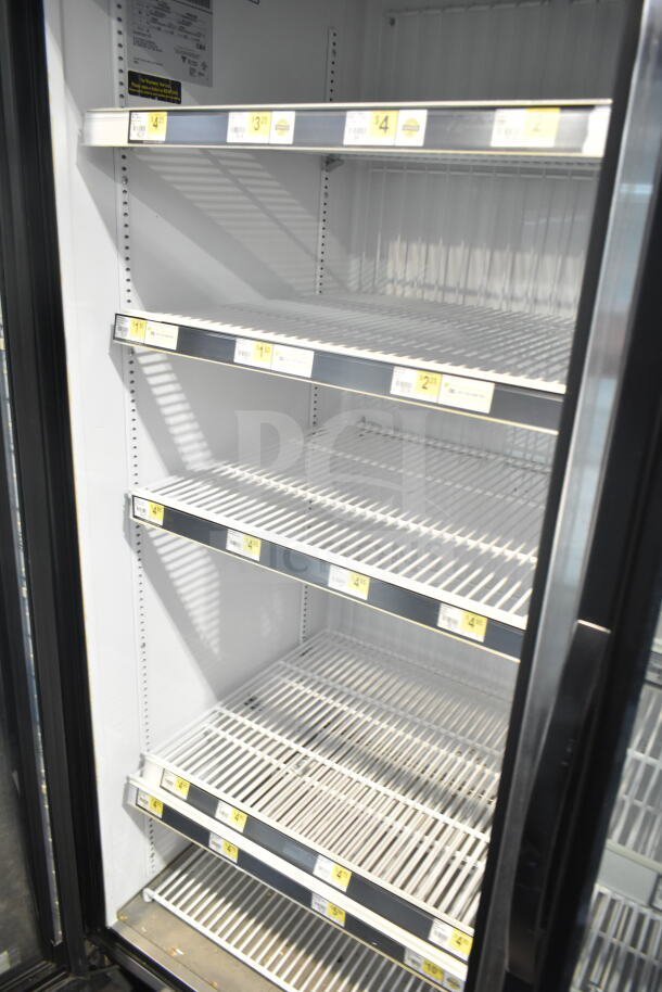 2017 True GDM-72F-HC commercial freezer with three glass doors. Shelving intact. Operates on 115/208-230 volts, 1 phase.