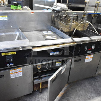 Giles EOF-24 Stainless Steel 3 Bay Fryer with Dumping Station, 480V, 3 Phase, features control panels and caution labels.