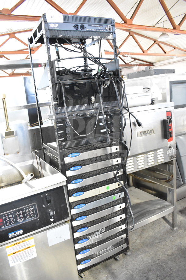 AV cart with 10 Crown CTs 1200 amplifiers, 3 Furman M-8x voltage regulators, Middle Atlantic rack, Samson unit.