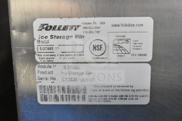 Follett SG700S Commercial Ice Bin, model SG700S, metal finish, warranty details visible, NSF certified label.