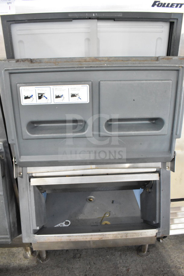 Follett SG700S-30 commercial ice bin, open with visible interior. Markings show usage instructions. Good condition.