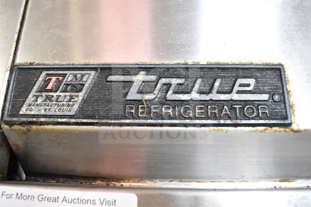 True T-23 commercial refrigerator label with brand name and model details, showing slight wear and patina.