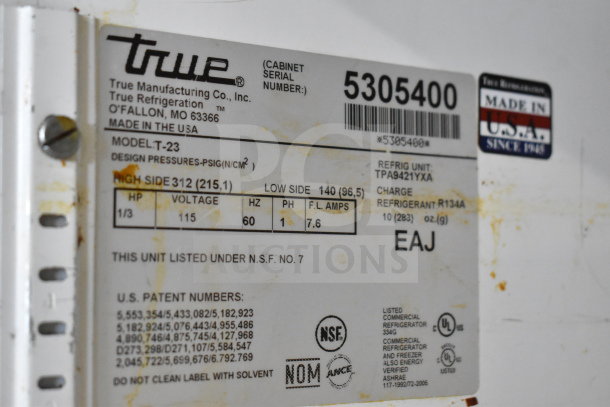 True T-23 commercial cooler label with model, voltage, and refrigerant details. Made in the USA. Serial number shown.