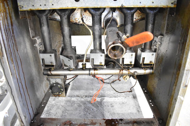 Dean SR162GN commercial gas fryer internals, showing burners and pipes. Used condition, visible wear and grease marks.