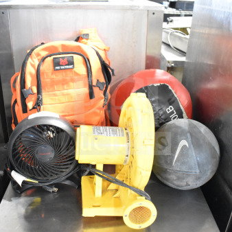 Five items: CFM-222A electric blower, Honeywell HT-900 fan, Fox Tactical orange backpack, red 20 lb ball, black Nike ball.