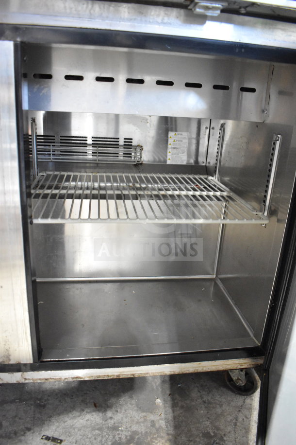 Turbo Air MST-48-N commercial prep table interior, stainless steel, shelving included, on casters; 115V, 1 phase.