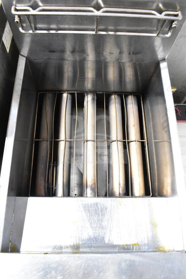 Dean SR162GN commercial deep fat fryer, natural gas powered, 150,000 BTU. Stainless steel interior, visible heating elements. Condition appears used.