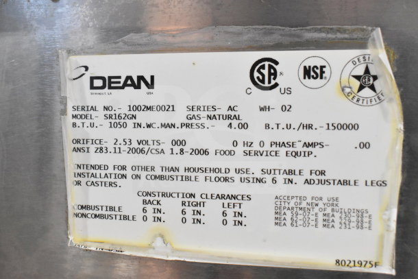 Label on Dean SR162GN fryer, showing model, serial number 1002ME0021, 150,000 BTU, and safety certifications for commercial use.