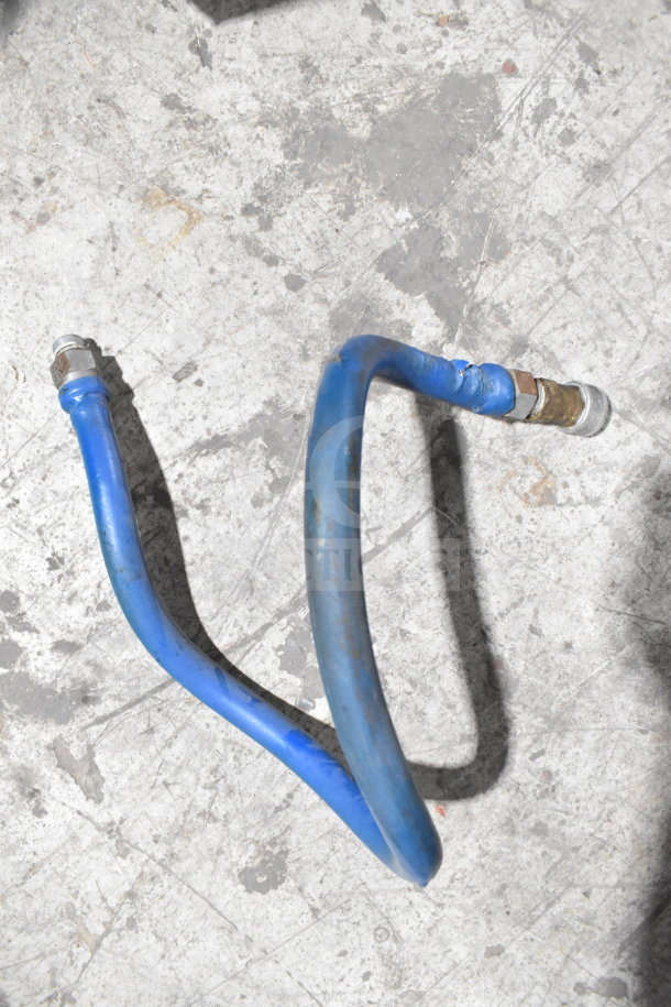 Blue gas line connector on concrete floor, part of Dean SR162GN Commercial Deep Fat Fryer setup.