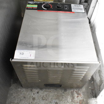 Weston PRO-1000 countertop food dehydrator, stainless steel, 115V, 1 phase. Control panel with dials; auction tag visible.