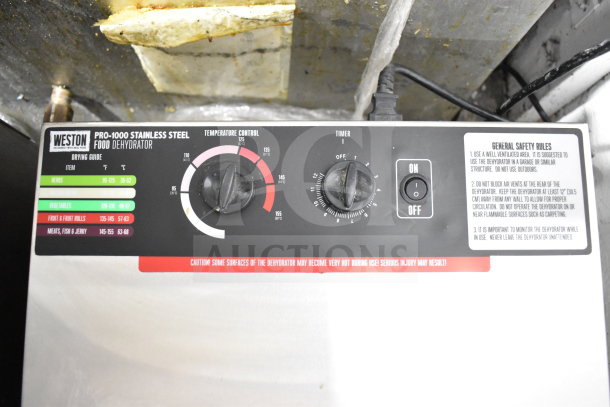 Weston PRO-1000 Countertop Food Dehydrator with adjustable temperature control and timer. Visible safety instructions.