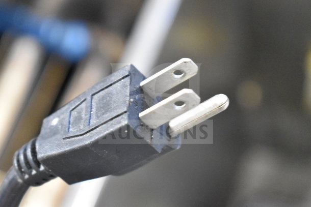 Power plug of Weston PRO-1000 food dehydrator, 115V, 1 Phase. Black cord, standard two-prong plug, lightly worn.