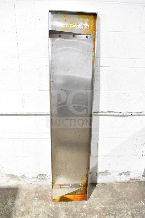 Metal wall mount shelf with rust and wear, rectangular shape, used condition, suitable for industrial spaces.