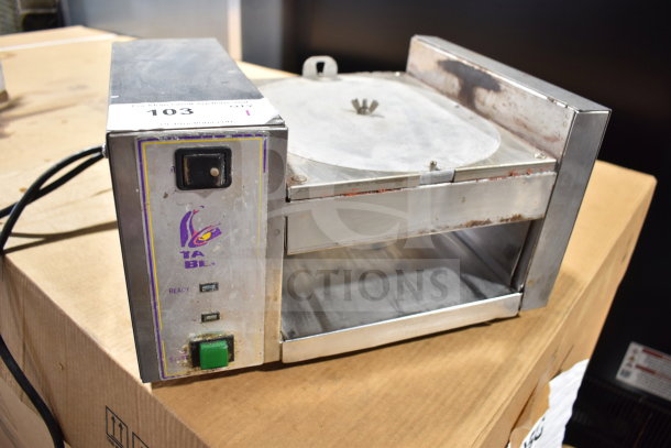 AJ Antunes TBS-1X countertop Taco Bell steamer, 208 volts, visible wear, model label intact, on a cardboard box.