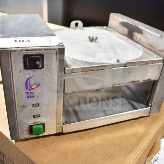 AJ Antunes TBS-1X countertop Taco Bell steamer, 208 volts, visible wear, model label intact, on a cardboard box.