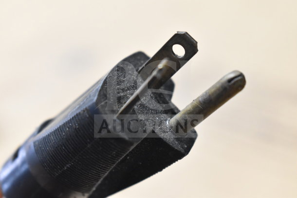 Close-up of a power plug for AJ Antunes TBS-1X Countertop Taco Bell Steamer, showing prongs and plug detail.