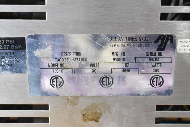 AJ Antunes TBS-1X Taco Bell Steamer, 208V, Model No. TBS-1X. Shown are markings with model, volts, and ETL certification.