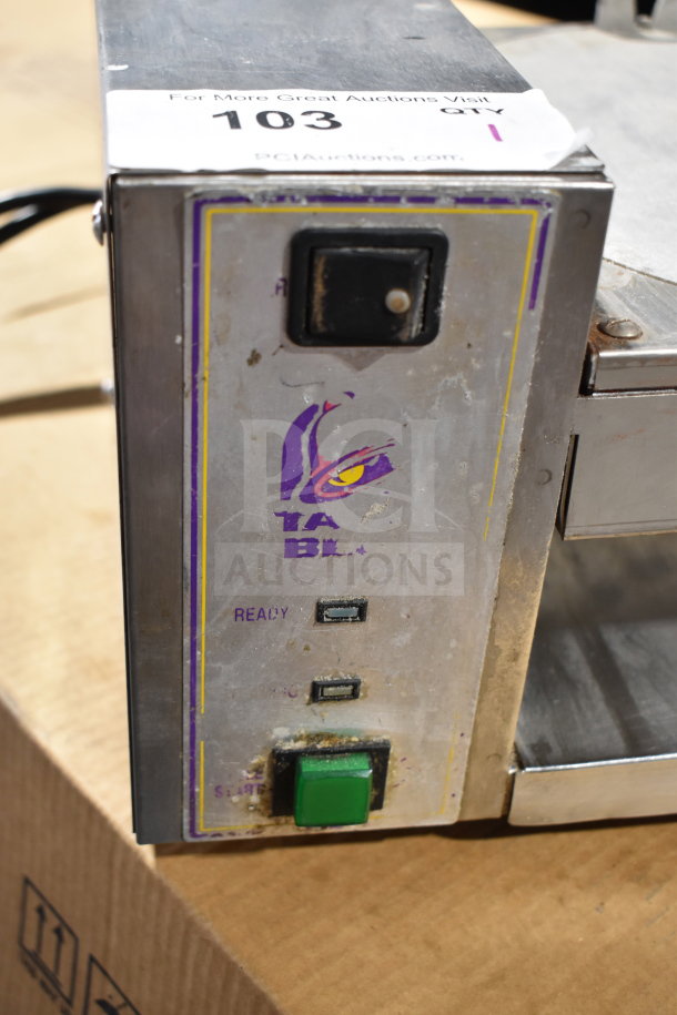 AJ Antunes TBS-1X countertop Taco Bell steamer, 208 volts, visible wear, brand logo on front panel, power and start buttons.