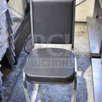 Lancaster Table & Seating banquet chair, black vinyl seat, silver vein frame, new scratch and dent, auction item.