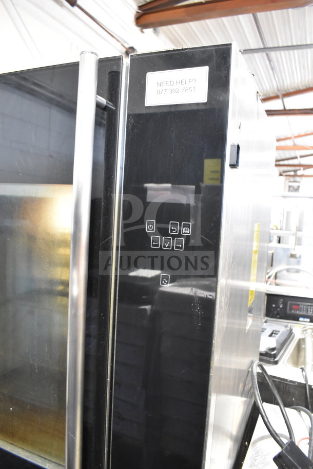 Fri-jado TDR 7-P rotisserie oven with digital controls, commercial casters, and 208V, 3 phase power. Visible help label.