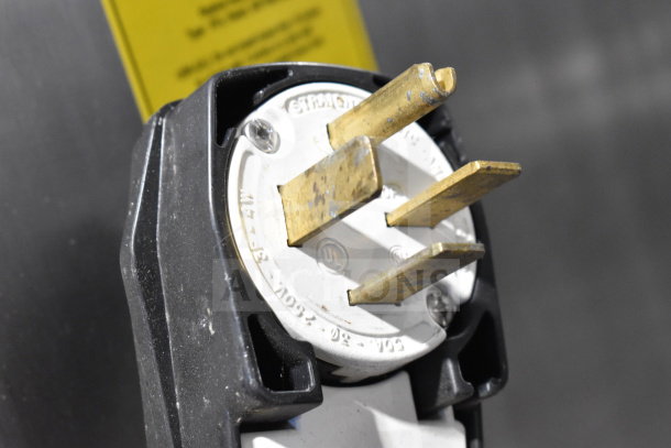 Close-up of a Fri-jado TDR 7-P rotisserie oven plug, showing 208V, 3 phase power connector.