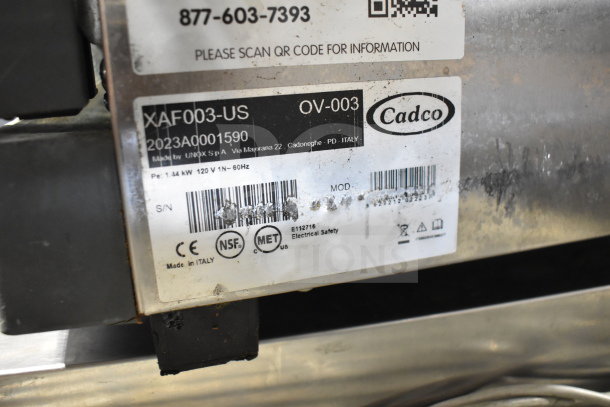 2023 Cadco Unox XAF003-US convection oven label showing model, 120V, and certification marks. Made in Italy.