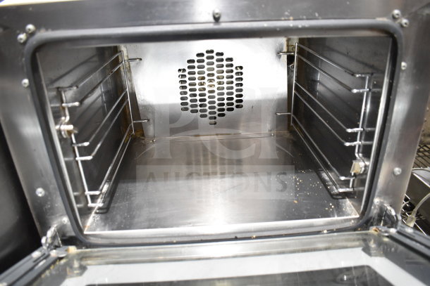 2023 Cadco Unox XAF003-US Roberta countertop convection oven, metal finish, 120V, used condition, clean interior.
