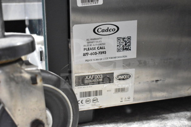 Cadco Unox XAF003 Roberta convection oven, metal exterior, 120V, 1 phase. Labels with model info and service contact shown.