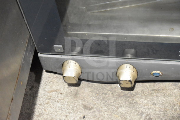 Cadco Unox XAF003 Roberta convection oven, electric-powered, 120 volts, showing control knobs and temperature settings. 