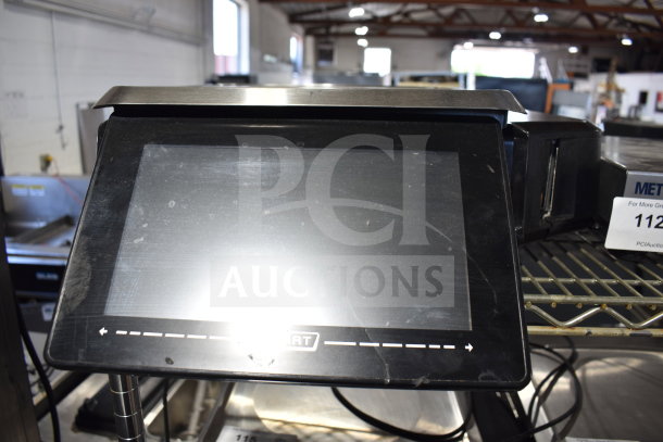Hobart HTi-7LH4W commercial food portioning scale, missing power cord, countertop model. Black touchscreen display.