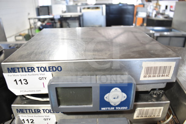 Mettler Toledo BC Commercial Food Portioning Scale, stainless steel, digital display, barcode tags visible, good condition.