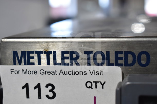 Mettler Toledo BC Commercial Scale, stainless steel, shows model and branding, slight wear, auction tag visible.