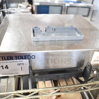 Mettler Toledo BC Commercial Countertop Food Portioning Scale in used condition, showing metal surface and barcode tag.