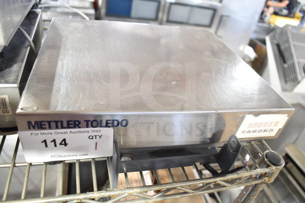 Mettler Toledo BC countertop food portioning scale, stainless steel, model BC, in good condition, with barcode label.
