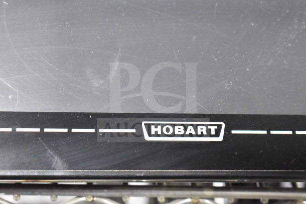 Hobart commercial food portioning scale, black finish, visible scratches, logo displayed, 120/208-240V, 1 Phase.