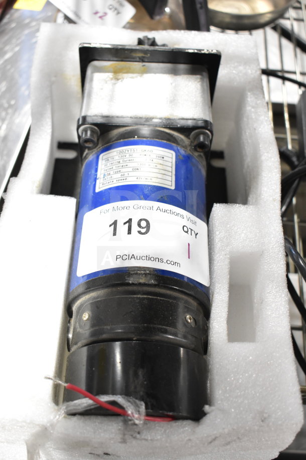 100ZYT51 GK60 Motor in packaging, model label visible, indicates power 700W, rotate speed 47 r/min. Auction tag 119 attached.