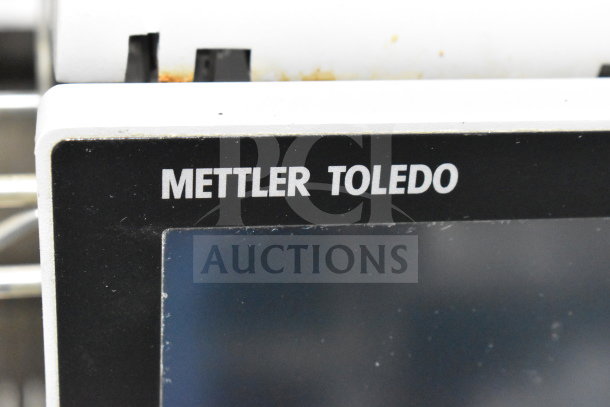 Mettler Toledo Countertop Food Portioning Scale, black display panel, visible brand name.