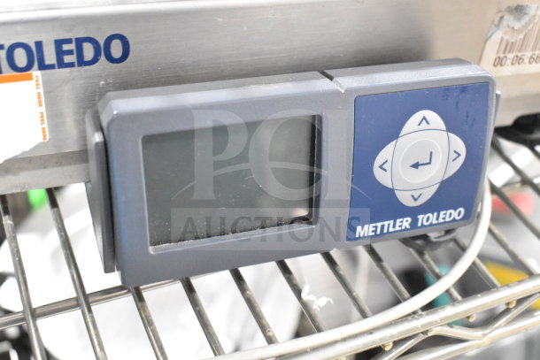 Mettler Toledo BC commercial countertop food portioning scale with digital display, stainless steel body, and control panel.