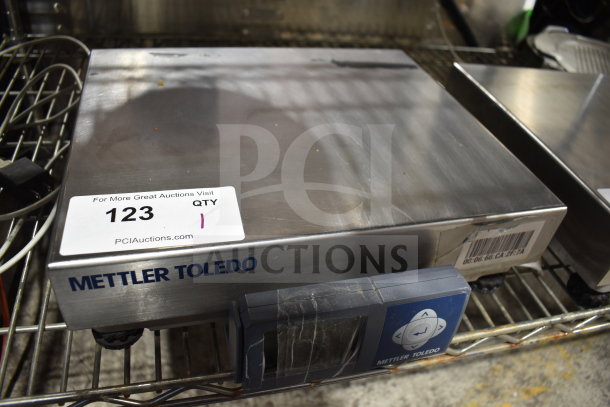 Mettler Toledo BC Commercial Countertop Food Portioning Scale, stainless steel, visible barcode, digital display, good condition.