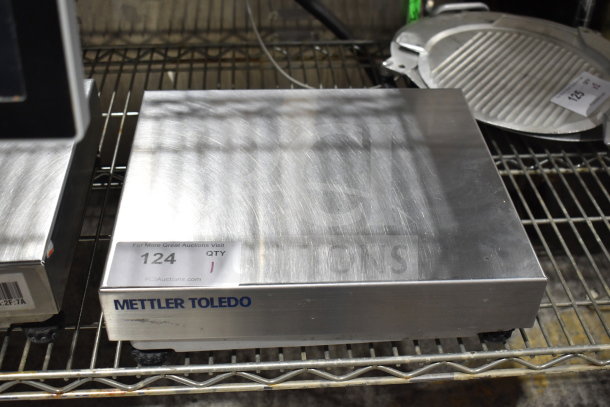 Mettler Toledo BC commercial countertop food portioning scale, stainless steel, in good condition, with visible model label.